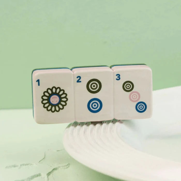 Whether you're hosting a mahjong gathering or looking for a unique decorative accent, this mini adds personality and style to your table.
