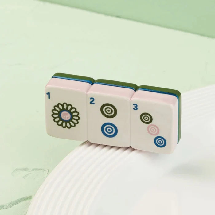 Whether you're hosting a mahjong gathering or looking for a unique decorative accent, this mini adds personality and style to your table.