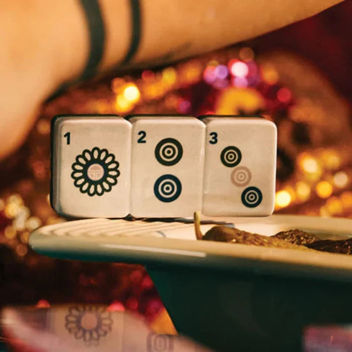 Whether you're hosting a mahjong gathering or looking for a unique decorative accent, this mini adds personality and style to your table.
