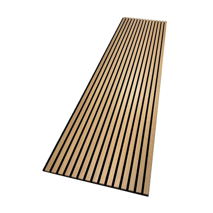 An angled view of an Oak Acoustic Slatwall Panel on a white background
