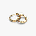 PANDORA Beaded Huggie Earrings in 14k gold plating with delicate bead detailing and a sparkling center stone