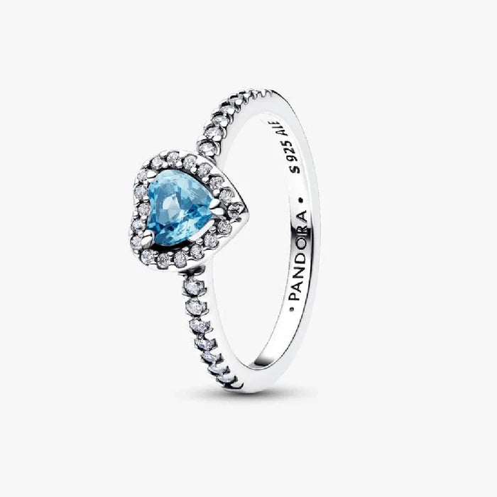 A ring featuring a blue topaz center stone surrounded by sparkling white diamonds.