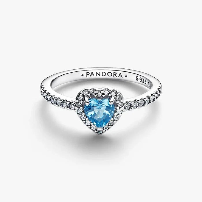 Elegant ring showcasing a blue topaz with a halo of white diamonds.