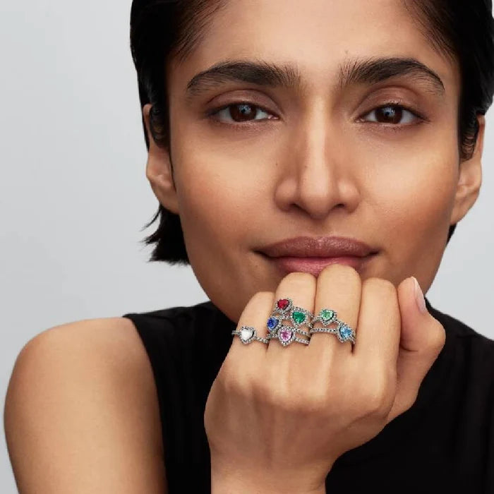 A stunning blue topaz ring adorned with shimmering white diamonds.