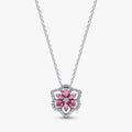 A pink flower pendant adorned with diamonds, elegantly hanging from a delicate chain.