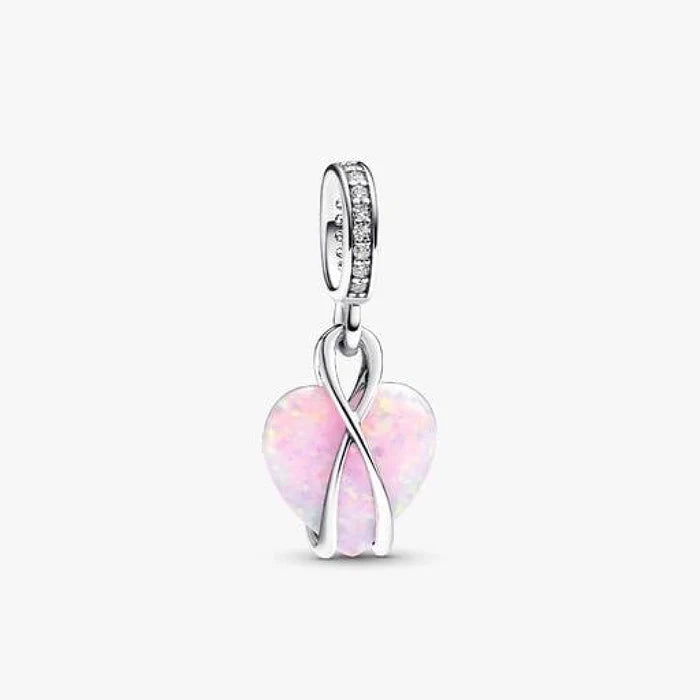 This Pandora Mum Opalescent Heart Dangle Charm offers a beautiful way to celebrate the special bond between a mother and child.