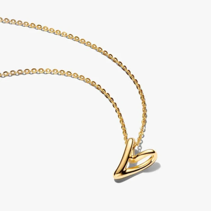 14k gold‑plated openwork heart pendant on a chain