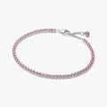 Pandora Pink Small Tennis Bracelet in sterling silver featuring a continuous row of pink cubic zirconia stones, displayed on a white background.