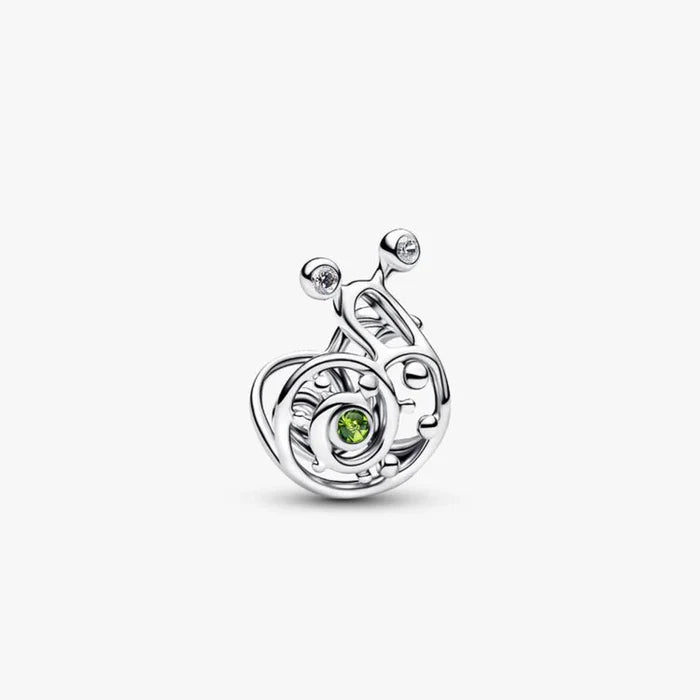 A silver and green enamel charm shaped like a snail, showcasing intricate detailing and vibrant colors.