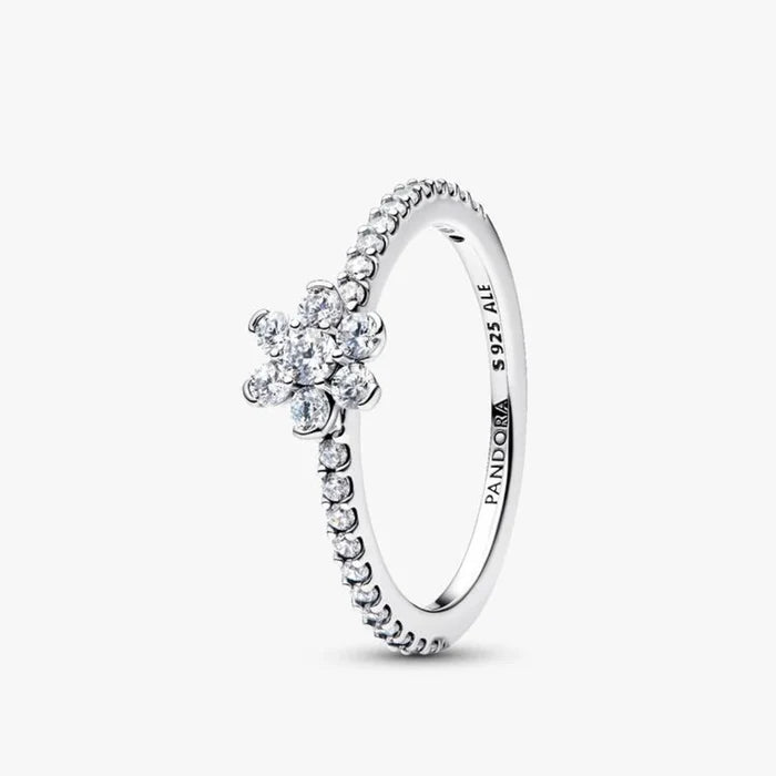 A diamond flower ring featuring a delicate white gold band, showcasing intricate floral designs with sparkling gemstones.