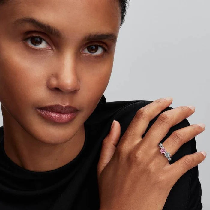 A stunning diamond flower ring with a white gold band, designed with a floral motif adorned with brilliant diamonds.