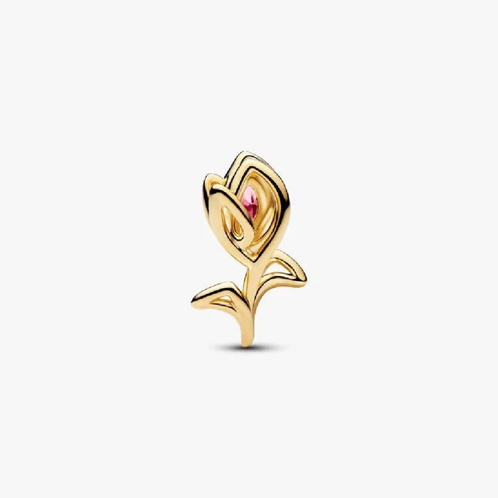 A gold plated rose charm featuring pink stones, symbolizing love and beauty in a stylish accessory.