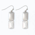 Burnished silver rectangle dangle earrings with a sleek textured metallic finish