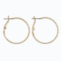 Periwinkle delicately textured gold hoop earrings with a classic silhouette and refined finish