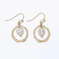 Hammered gold ring earrings featuring elegant pearl drops and textured metallic detailing