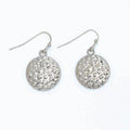 Hammered silver circle earrings featuring a textured finish and classic round design