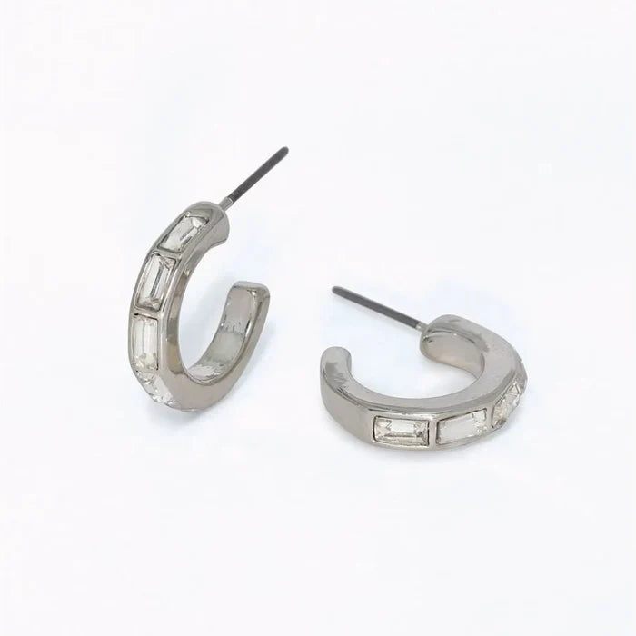 Silver hoop earrings featuring clear crystal accents and a polished elegant design