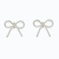 These Periwinkle Silver Rope Bow Earrings features a graceful bow-inspired design with intricate rope-like detailing that creates beautiful texture and dimension.