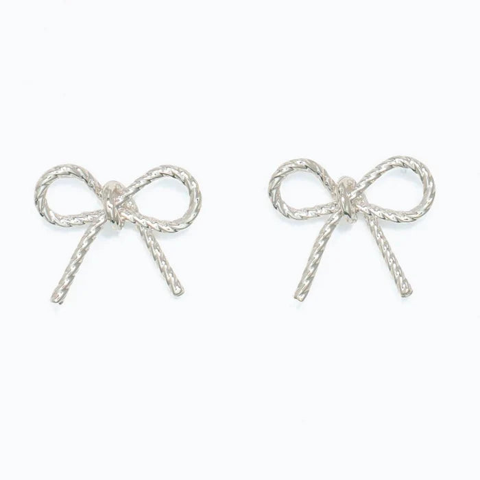 These Periwinkle Silver Rope Bow Earrings features a graceful bow-inspired design with intricate rope-like detailing that creates beautiful texture and dimension.