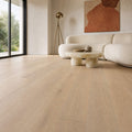 Modern living room with Potters Grey Oak Matt Lacquered 190mm engineered wood flooring, neutral furniture, and large windows.