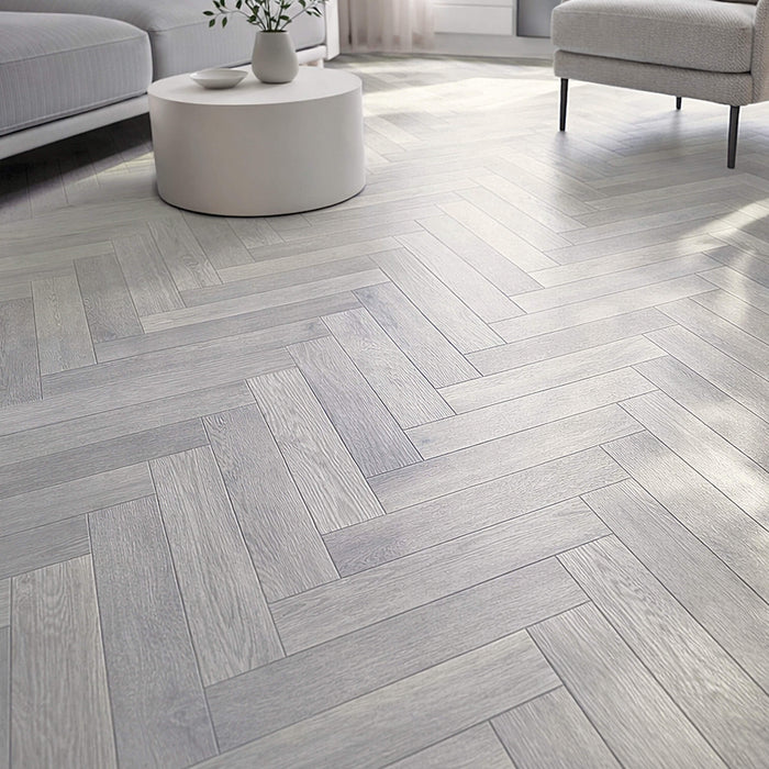 Pyrenees Oak Herringbone Rigid LVT Flooring in a living room setting.
