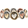 Rain Jewelry Multimetal Beating Hearts Bracelet. This striking stretch bracelet features a beautiful sequence of textured oval medallions, each showcasing a raised heart with a radiant, stamped sunburst design.