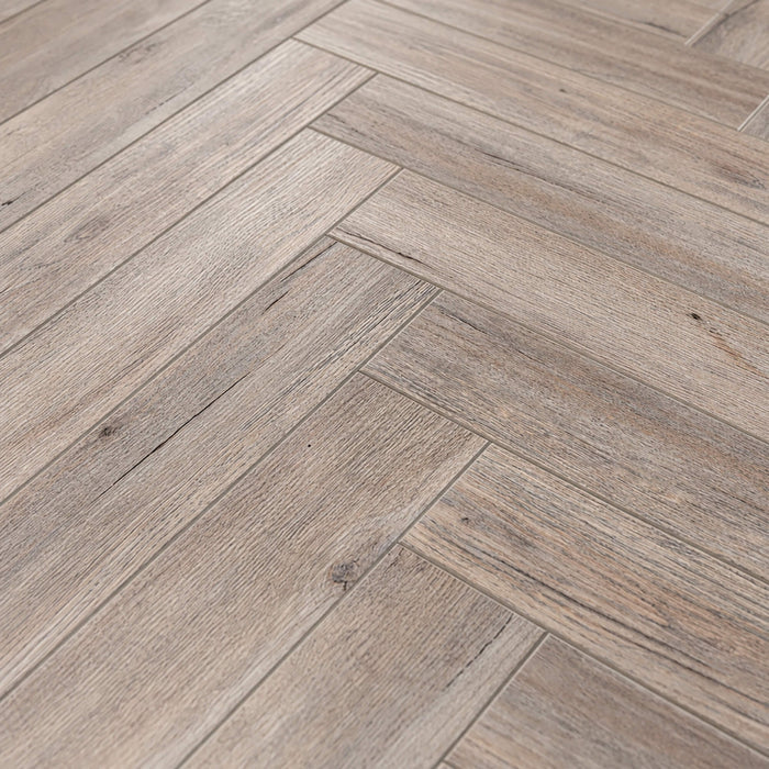 Close-up of Riviera Oak Rigid LVT Herringbone Flooring.