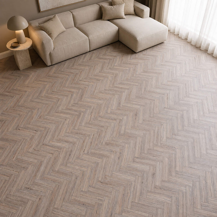 Riviera Oak rigid LVT herringbone flooring in a home living room setting.