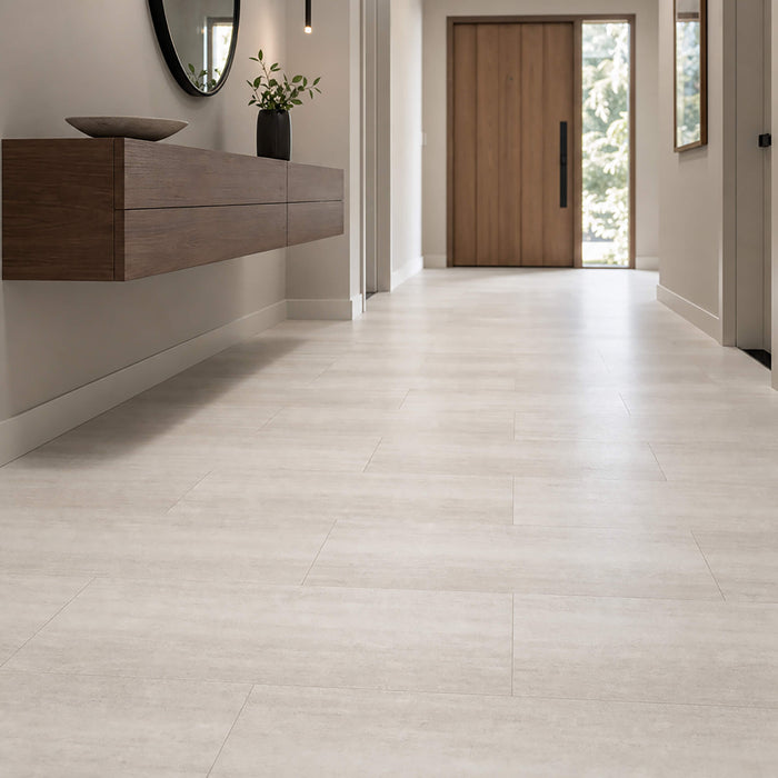Modern interior with Sandstone Rigid LVT tile flooring, wooden vanity, and large mirror.