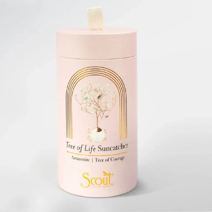 A light pink cylindrical container for a "Tree of Life Suncatcher" is shown.