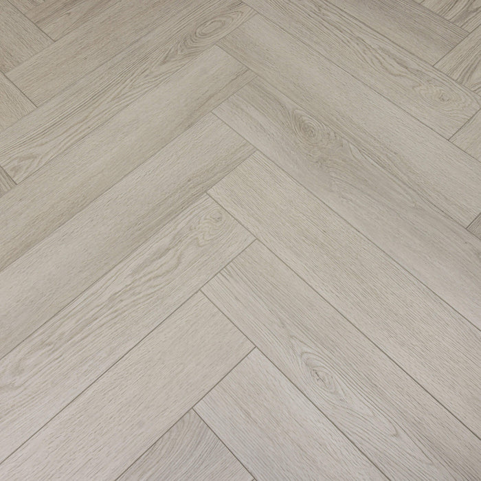 Close-up of Siberian Oak Rigid LVT herringbone flooring