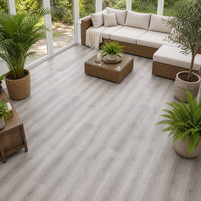Silver Grey Oak Prestige laminate flooring in a home conservatory setting.