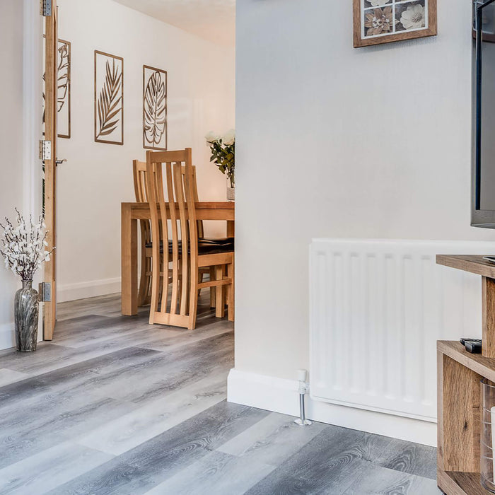 Silver Grey Oak Prestige Laminate Flooring in a home interior setting.