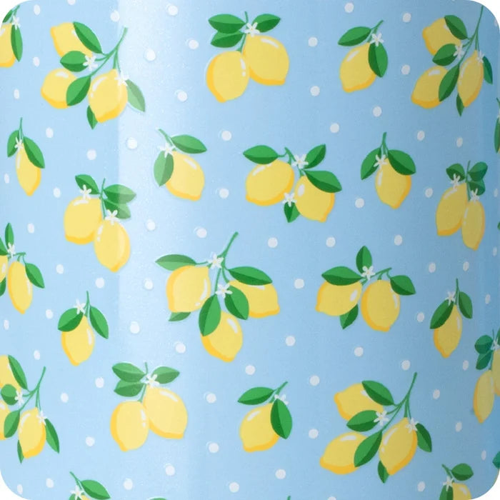 A blue travel mug adorned with a cheerful lemon pattern.