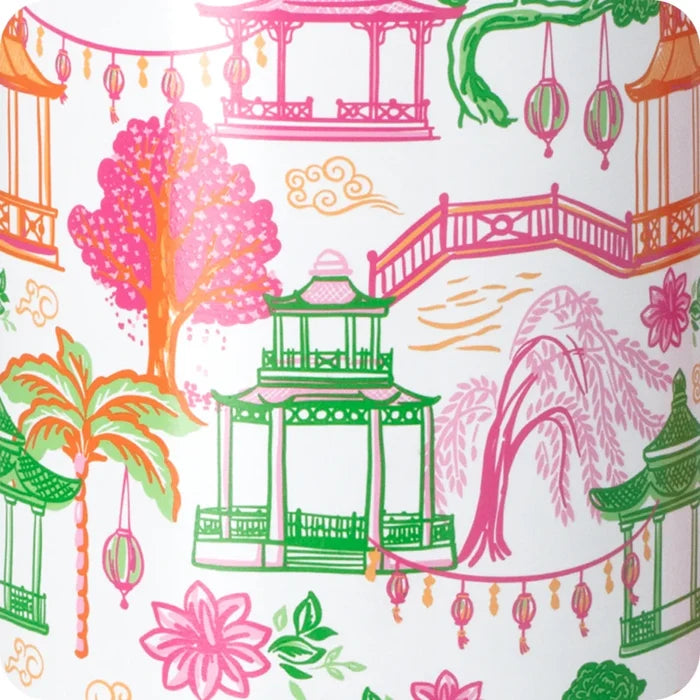 A stylish white wine glass featuring a pink lid and a decorative tassel, adding a touch of elegance to the drinkware.