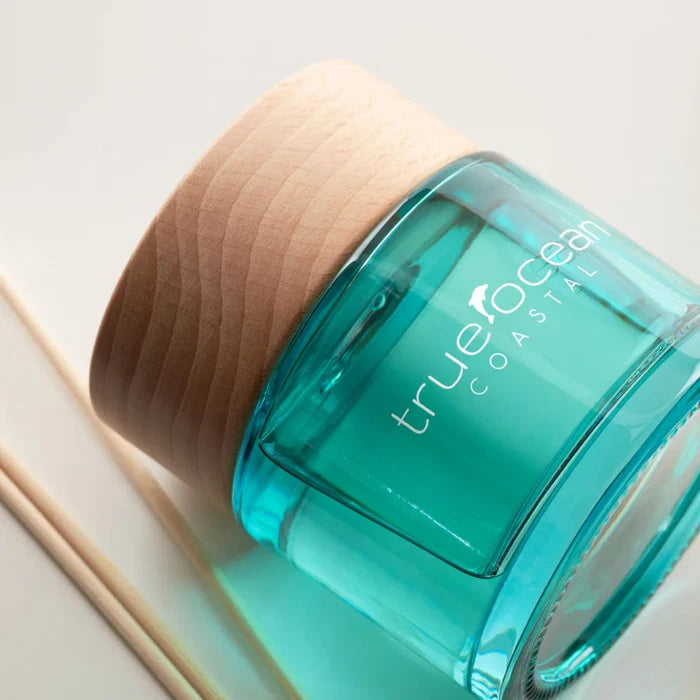 Infused with our signature essential oil-based fragrance, Coastal, this diffuser fills your space with the fresh, sunlit aroma of bergamot, palm leaf, and mandarin — a carefree blend of sand, surf, and ocean breeze.