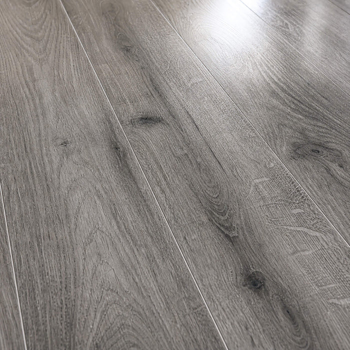 Close-up of the grain and texture on Uptown Oak Gloss laminate flooring.