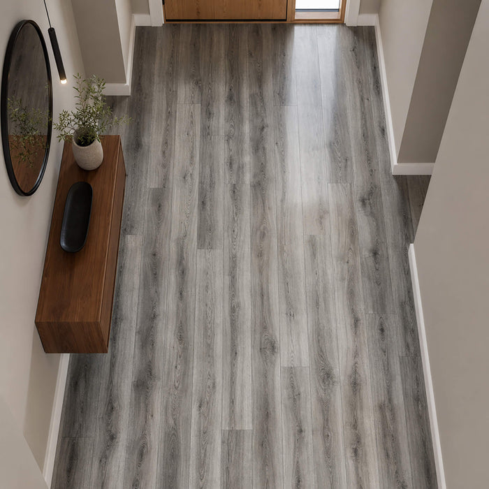 Elevated view of Uptown Oak Gloss laminate flooring in a home hallway setting.