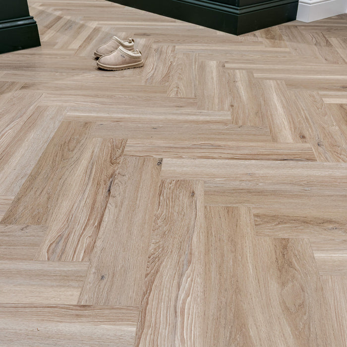 Volcanic Larch Rigid LVT Herringbone Flooring in a kitchen room setting.