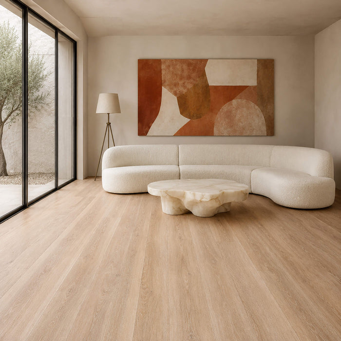 Modern living room with a beige sofa, abstract painting, and Volcanic Larch Rigid LVT super plank flooring.