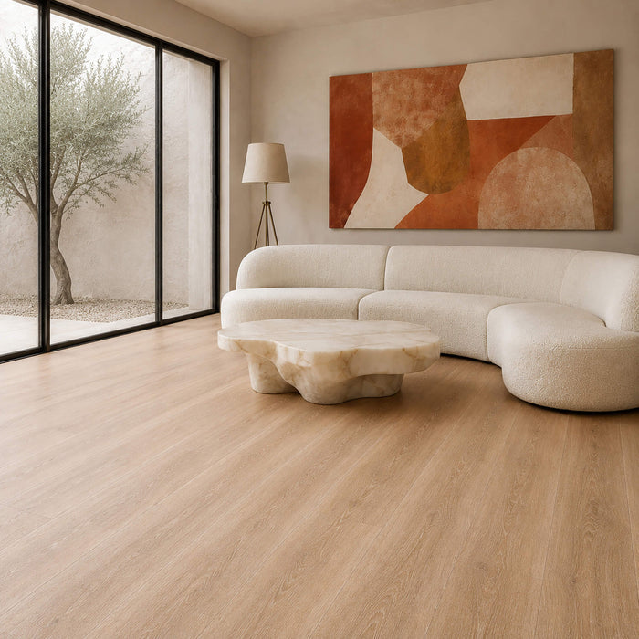 Modern living room with a white sofa, abstract painting, and Volcanic Larch Rigid LVT super plank flooring.