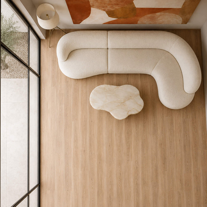 Elevated view of a modern living room with Volcanic Larch Rigid LVT flooring.