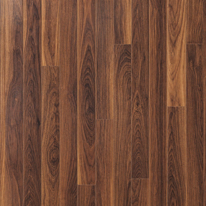 Close-up of the visible grain pattern of Walnut prestige laminate flooring.