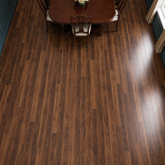 Elevated view of Walnut prestige laminate flooring in a dining room setting.