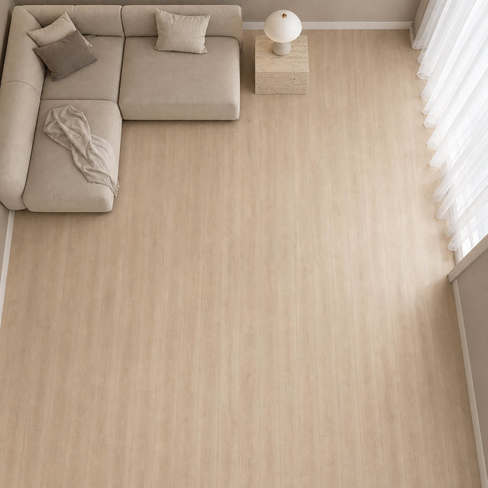 Elevated view of Washed Oak Essentials laminate flooring inn a living room setting.