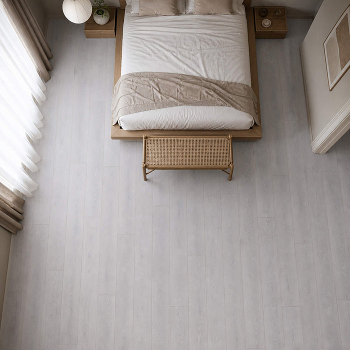 Elevated view of Yosemite Oak Country laminate flooring in a bedroom setting.